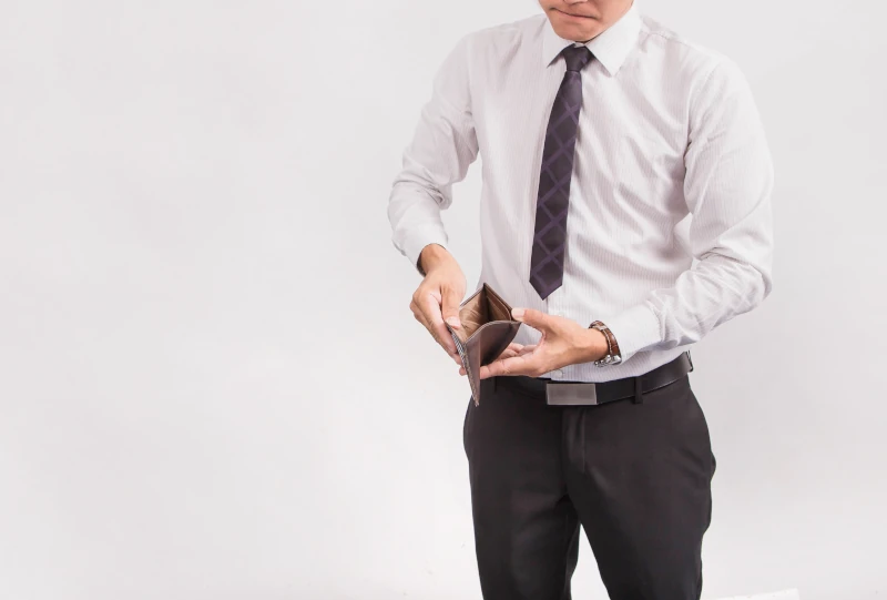 Image of businessman with empty wallet