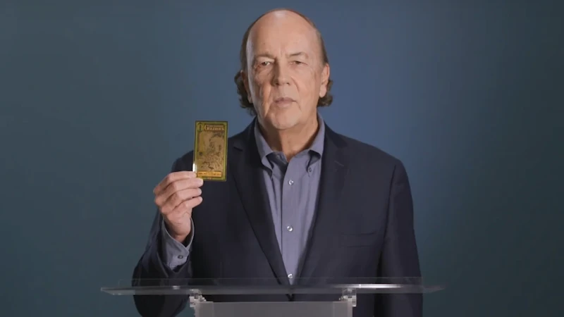 Jim holding a Goldback