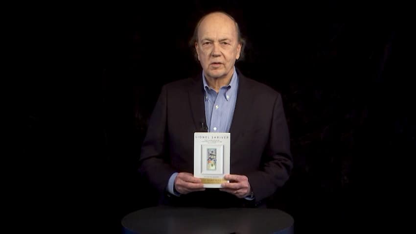 Jim holding a book