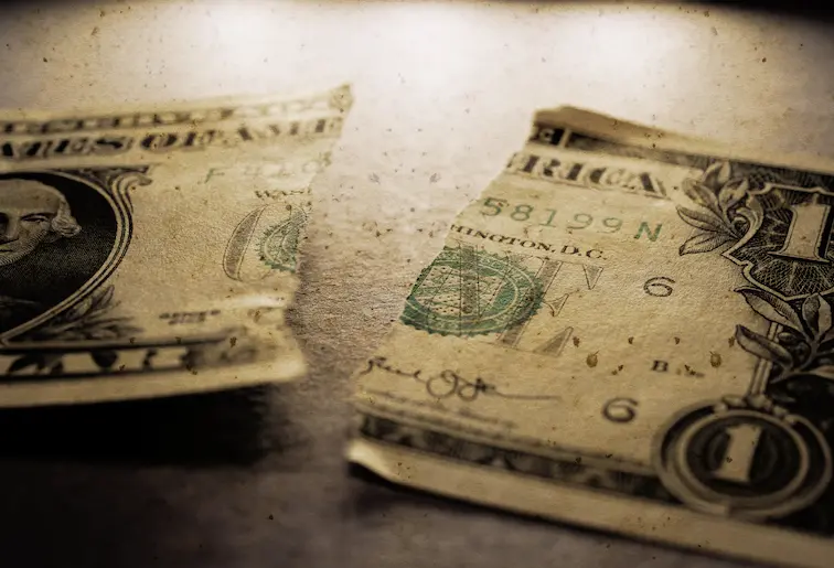 torn US dollar