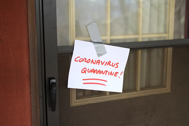 Sign posted on house door 'Coronavirus Quarantine'