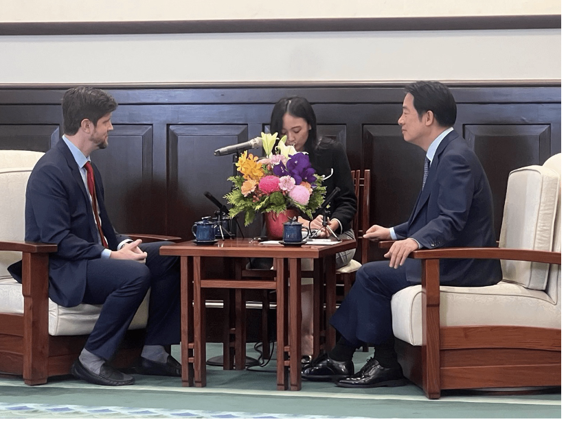 A group of people sitting at a tableAI-generated content may be incorrect.