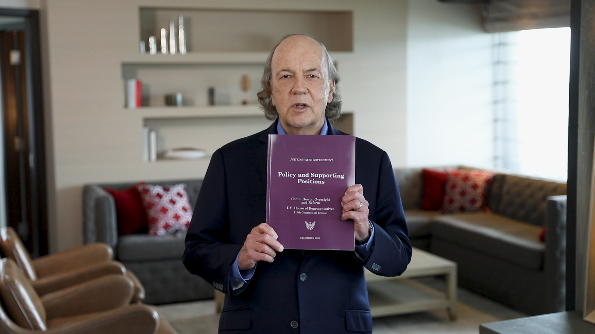 Jim Rickards holding book